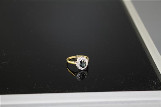 An 18ct and Plat, sapphire and illusion set diamond oval cluster ring, size M, gross weight 3.5 grams,